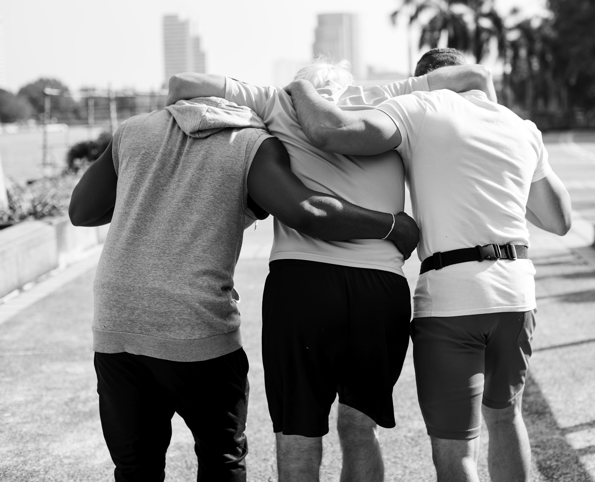 Men assisting an elderly